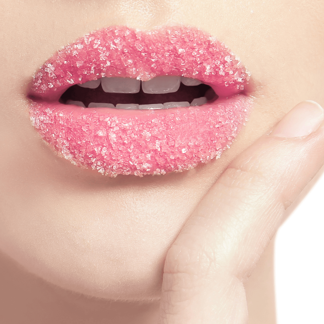 Gommage Lèvres Hydralips applied on pink lips, showcasing smooth exfoliation with sugar crystals.